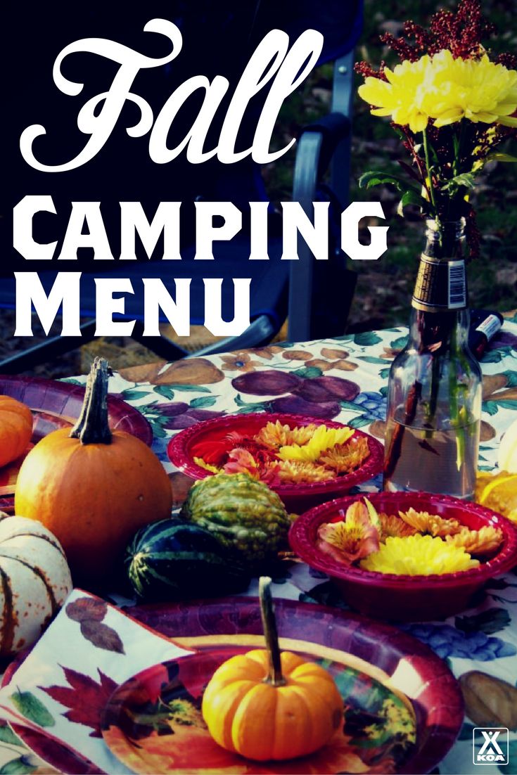 fall camping menu with pumpkins, squash and gourds on a table cloth