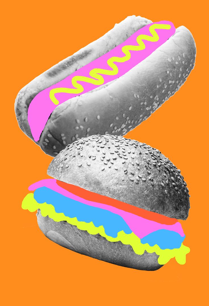 two hotdogs with buns and sprinkles on an orange background