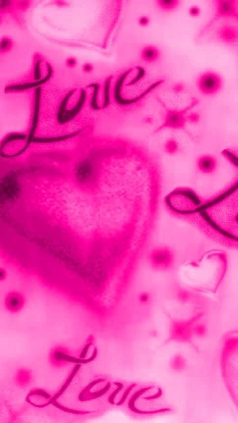 two hearts with the word love spelled in black ink on a pink and white background