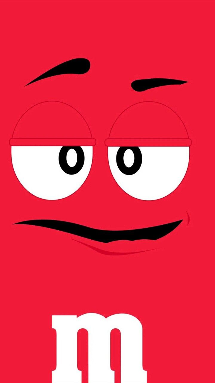 the letter m with eyes and nose drawn on it's face, in front of a red background