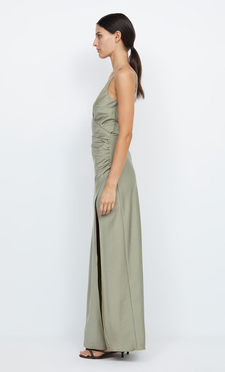 The Eternity V Maxi Dress is a wrap style cut on the bias in a flattering silhouette. The maxi dress features a v-neck and back, ruching at the cinched waist and straight maxi skirt with leg split. Evening Ruched V-neck Maxi Dress, Pre-draped Maxi Dress With Side Slits, Fitted Maxi Dress With Side Slits And Pre-draped Style, Floor-length Maxi Dress With Ruched Back For Date Night, Elegant Ruched Maxi V-neck Dress, Spring Pre-draped V-neck Maxi Dress, Formal V-neck Maxi Dress With Ruched Back, Pre-draped Ruched Floor-length Maxi Dress, Spring Gala Dress With Ruched Back