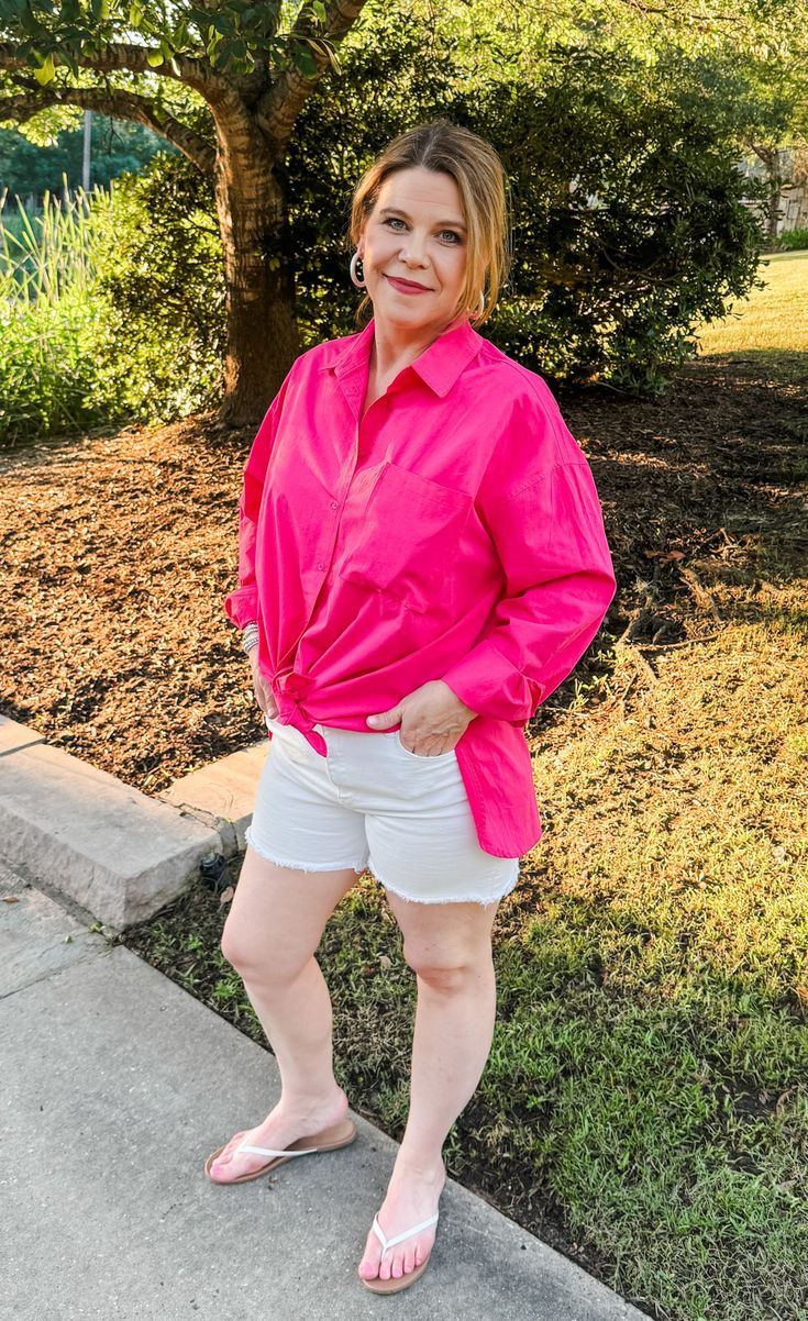 Get ready to Stand Up & Smile with this crisp collared button-down shirt in Raspberry pink! Made with 100% cotton, it features a flat pocket on the front, side slits, and endless style options. Layer it over a tank top or roll up the sleeves for a fun and versatile look. (Be prepared for compliments!) Features: Functional buttons down front. Cuffed sleeves- roll up or leave down Side slits for style and comfort Rounded hemline Fabric: 100% Cotton Brand: Double Zero Size Recommendation: S= Up to Pink Collared Shirt For Day Out, Pink Collared Top For Day Out, Spring Day Out Shirt With Pockets, Spring Shirt With Pockets For Day Out, Pink Shirt For Workwear In Summer, Pink Summer Workwear Shirt, Summer Pink Blouse With Pockets, Oversized Pink Blouse With Pockets, Chic Pink Tops With Pockets