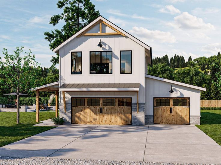 a two story house with an attached garage