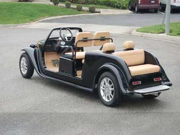 an old fashioned car is parked on the street