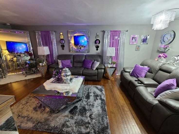 a living room filled with furniture and purple accents