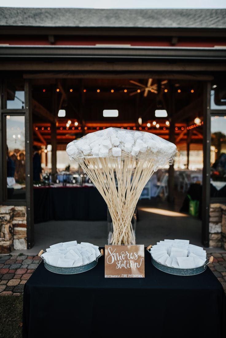 the table is set up with plates and napkins for guests to sit down at