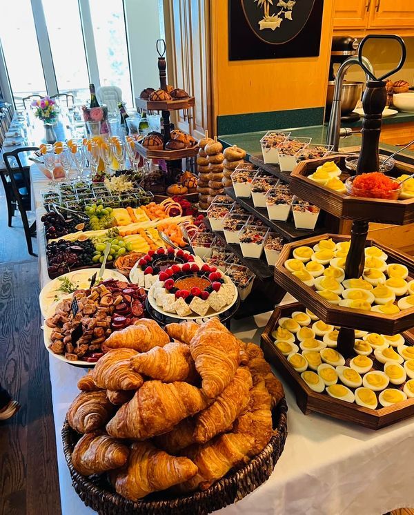 an assortment of pastries and desserts displayed on a table