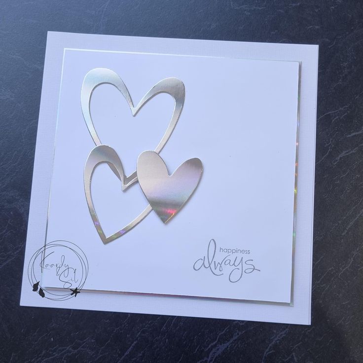 a card with two hearts cut out of it