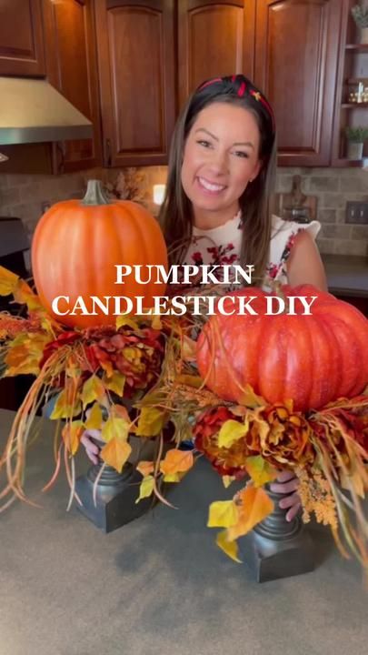 a woman sitting in front of two pumpkins on top of a kitchen counter with the words easy fall decor