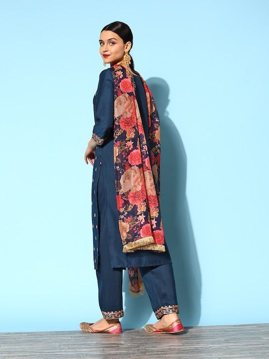 PRODUCT DETAILS Content - 1 Kurta, 1 Trouser, & 1 Dupatta Kurta Fabric -Silk Blend Trouser Fabric -Silk Blend Dupatta Fabric -Organza Colors -Blue & Gold Prints & Patterns -Polka Dot Print & Yoke Embroidery Necklines -Round Sleeve Styles -Three-Quarter Sleeves with Hem Length - Calf Length Fit -Regular Fit Size & Fit: Tailored to Perfection:The model wears a size S with the following measurements:Chest: 32"Waist: 28"Hips: 33"Height: 5'8" Please check the last image above for a complete size char Festive Silk Kurta With Floral Print, Semi-stitched Silk Palazzo Set For Navratri, Navratri Semi-stitched Silk Palazzo Set, Silk Kurta With Printed Motifs For Diwali, Silk Churidar For Navratri, Semi-stitched Silk Palazzo Set With Floral Print, Silk Palazzo Set With Straight Kurta And Pallu, Silk Palazzo Set With Dupatta For Festivals, Silk Churidar With Sheer Dupatta For Navratri