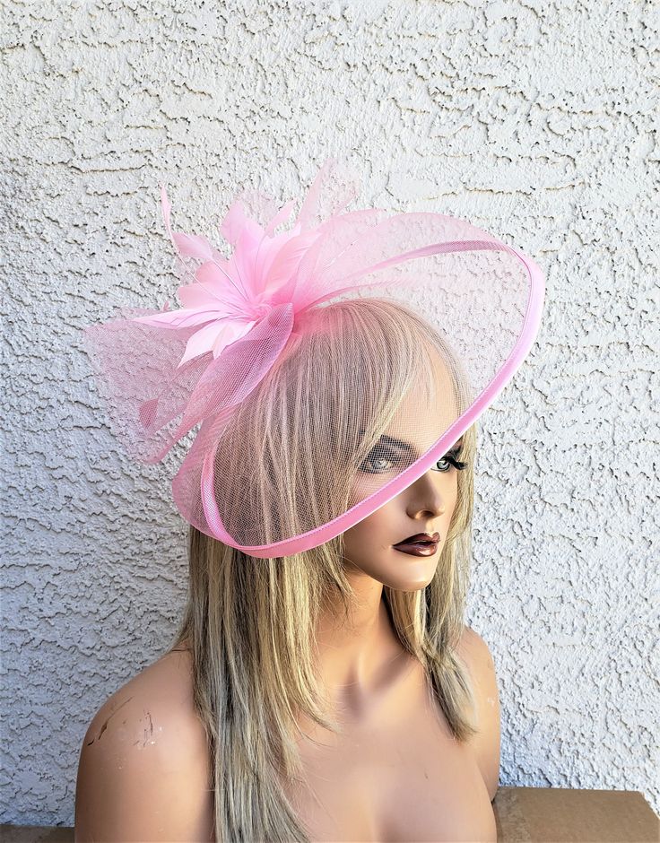 light pink crinoline fascinator with netting and a feather flower. Attaches with a headband or clip both included. Crinoline Fascinator, Cream Fascinator, Feather Bouquet, Ivory Fascinator, Pink Fascinator, Henderson Nv, Feather Flower, Derby Party, Kentucky Derby Hat