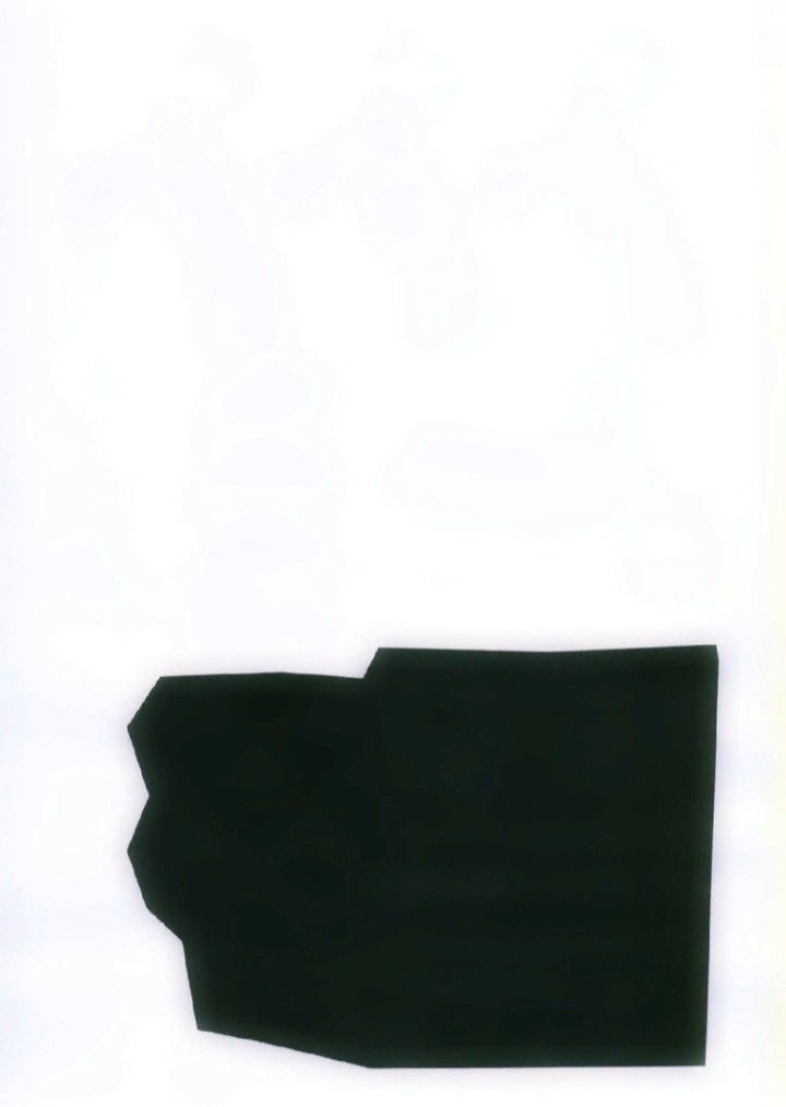 a black piece of paper that has been cut into shape and placed on a white surface