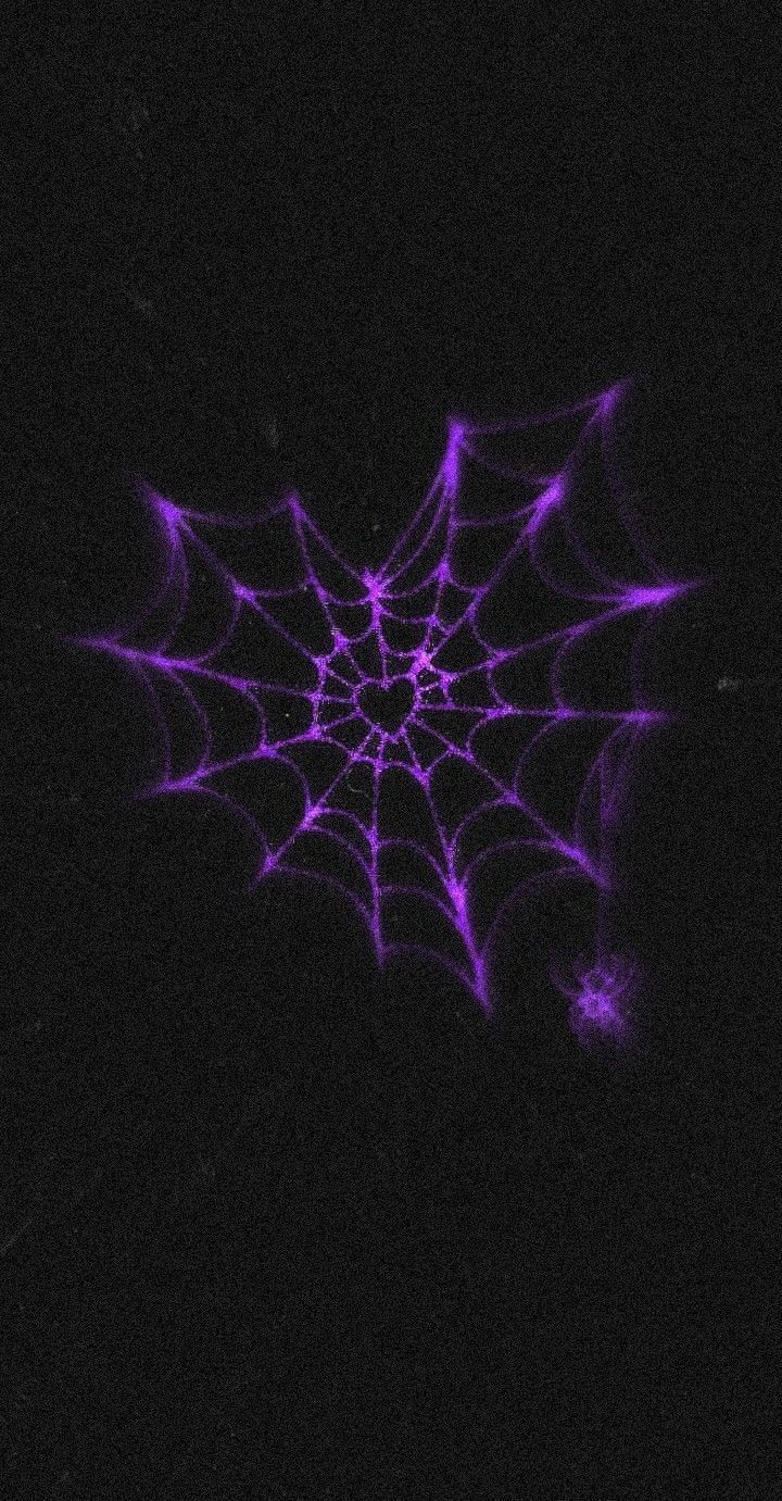 a purple spider web on a black background