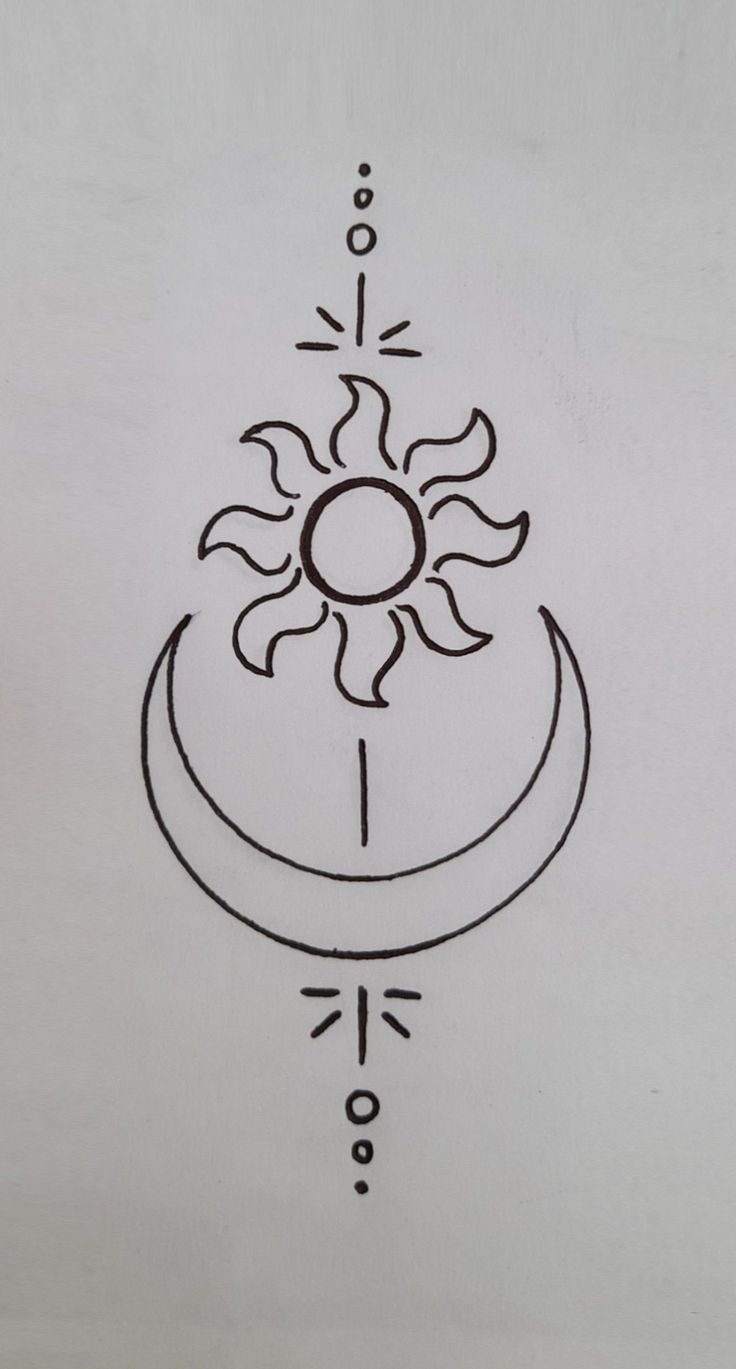 a drawing of a sun and moon on a white paper