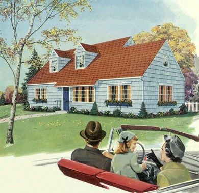 three people in a convertible car driving past a large blue house with red shingles