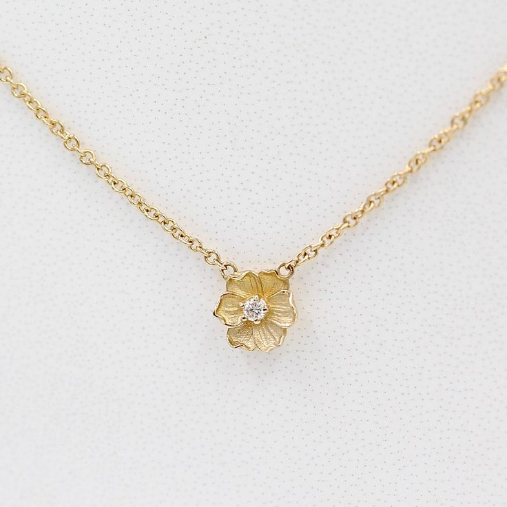 a close-up of a gold poppy flower necklace on a white surface Poppy Flower Necklace, Poppy Jewelry, Elegant Symbol, Poppy Earrings, Poppy Necklace, Poppy Pods, Diamond Heart Necklace, Prom Jewelry, Custom Ring Designs