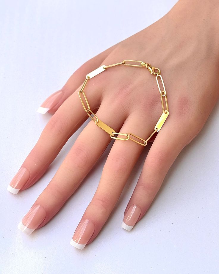 This 14-karat Solid yellow gold Paperclip cable chain bracelet features three links alternating with a bar, which is the ideal for customizing with engraved or stamped initial. The long links resemble paperclips and create a streamlined look. ★ ★ ★ The bracelet consist of -3.8mm 14k Solid Gold Cable link with Lobster clasp, -14.4 x 3.6mm 14k solid gold bar attach, -Total length is 7"  -Link Length: 0.59" (14.99mm) IT comes with beautiful jewelry gift box. MORE SOLID GOLD AND DIAMOND JEWELRY  htt South San Francisco, Etsy Promotion, Personalized Bracelet, Rainbow Earrings, Chain Extenders, Gold Bar, Bracelet Gold, Jewelry Gift Box, Solid Yellow