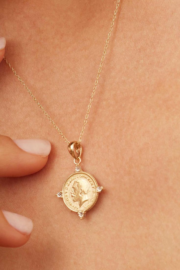 Our Legacy Coin Pendant Charm is the perfect brdige of history and style. Celebrating legacy and heirlooms, it depicts King George V, celebrated for his leadership during a pivotal era. The coin's vintage allure is enhanced by modern design elements, making it a versatile addition to any jewelry collection. Metal: 14k Solid Gold Dimensions: 20mm Coin Diamenter, 4mm Bale Opening Weight: 1.7 grams Origin: Crafted in Arezzo, Italy Classic 14k Stamped Coin Jewelry, Classic 14k Gold Coin Pendant Jewelry, Classic 14k Gold Jewelry With Coin Pendant, Classic Stamped 14k Coin Jewelry, Heirloom Yellow Gold Coin Jewelry, Heirloom Coin-shaped Yellow Gold Jewelry, Heirloom Coin Pendant Jewelry, Collectible Yellow Gold Diamond Necklace, Heirloom 14k Gold Coin Jewelry