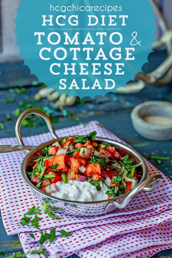 a bowl filled with cottage cheese salad on top of a red and white checkered cloth