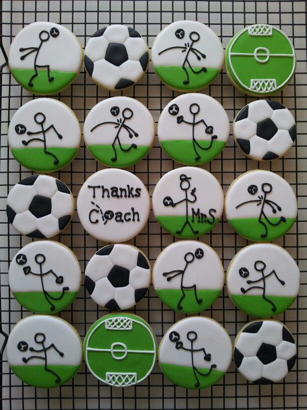 decorated cookies with soccer balls and words on them