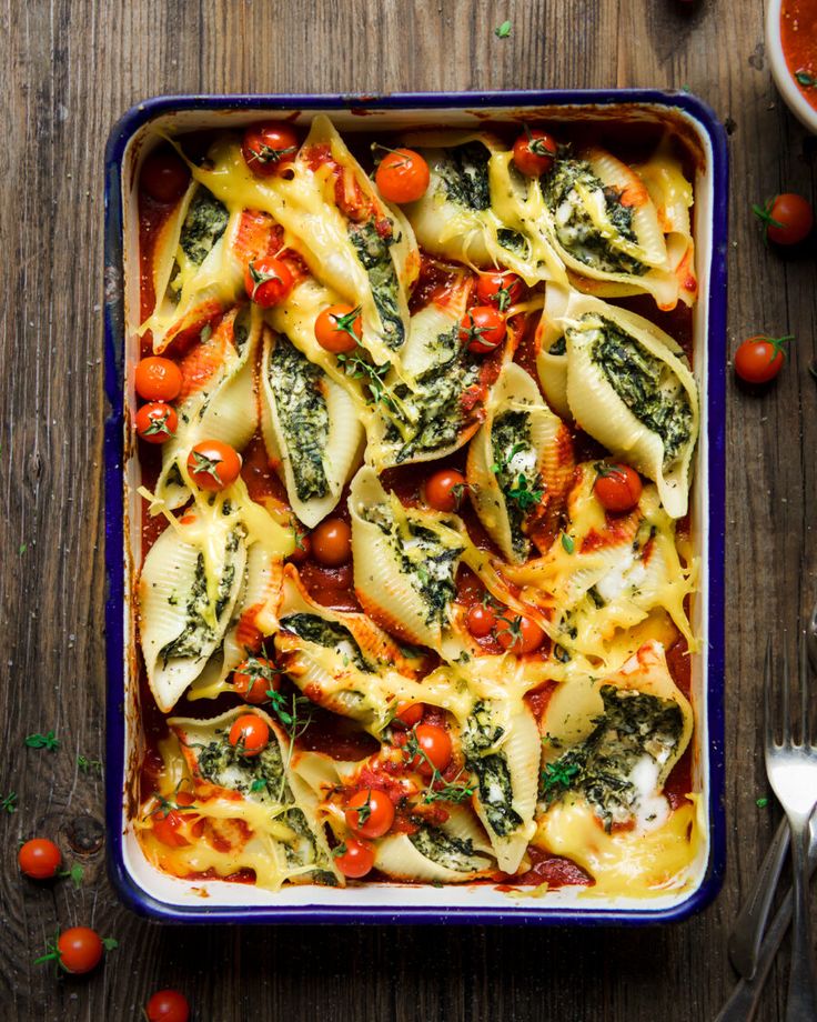 spinach and cheese vegan pasta bake in a casserole dish