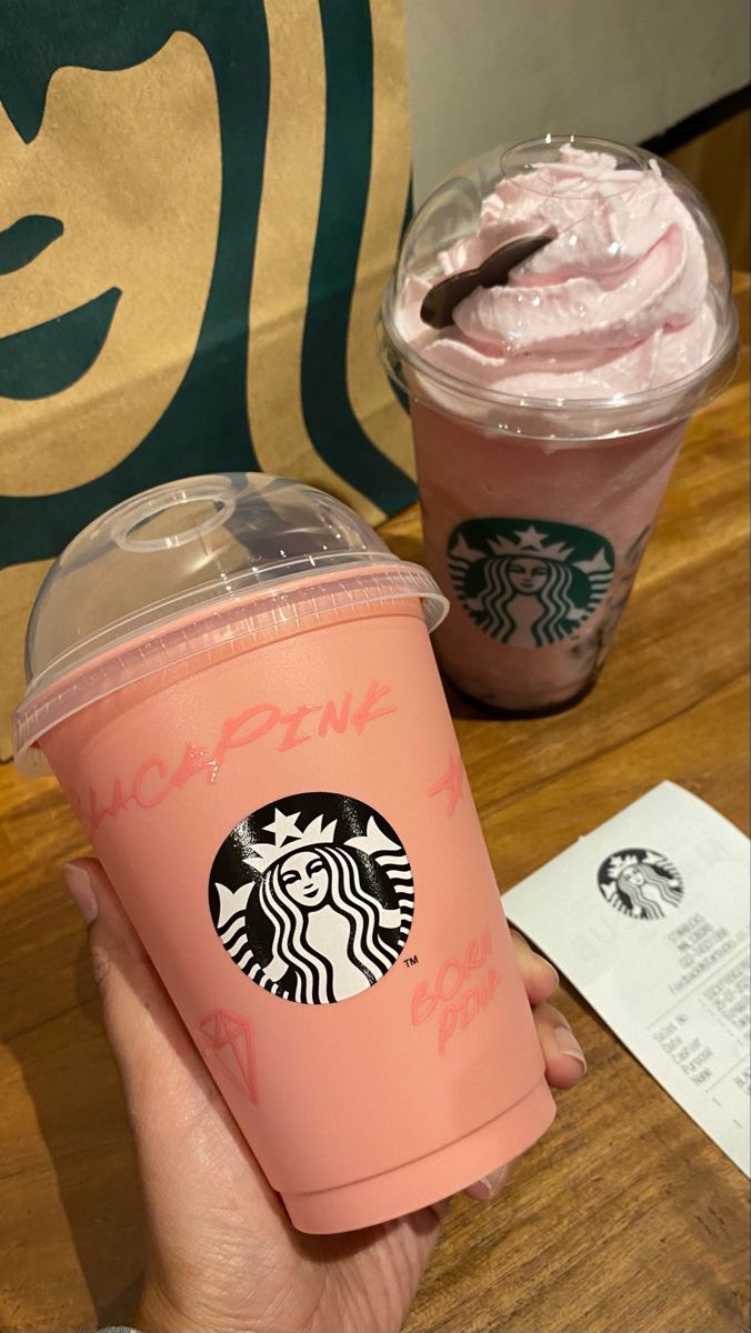 two starbucks drinks with pink frosting in their cups