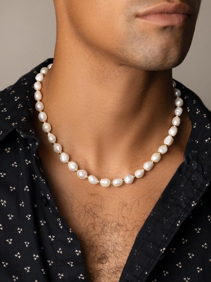 Cultured Baroque White Freshwater Pearls We use cultured pearls from oysters and freshwater mussels that we select by hand for all our jewelry Gold Filled Beads Approximate pearl size: 10 x 12 mm each Necklace has a 1.5 Inches Extension Chain Model is wearing 20 Inch Necklace Maluma and Shawn Mendes are wearing custom 19 Inch Necklace Product Code: MNEC_116 Designer's NotesStrung by hand in our LA studio from beautiful baroque freshwater pearls, this necklace will add a unique touch to all your Mens Beaded Necklaces, 20 Inch Necklace, White Freshwater Pearl, Unique Pendant, Hamsa Hand, Pearl Choker, Freshwater Pearl Necklaces, Pearl Size, Shawn Mendes