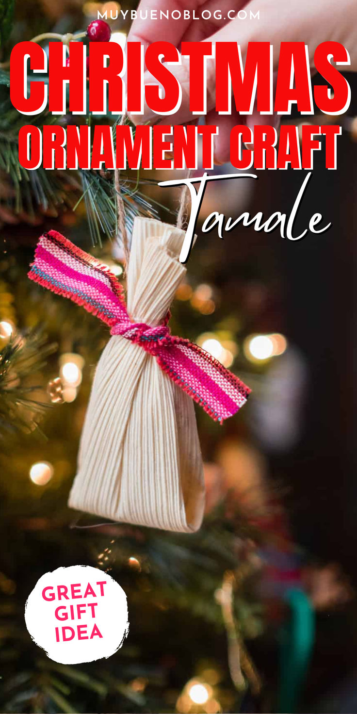 a christmas ornament craft is hanging from a tree with pink ribbon on it