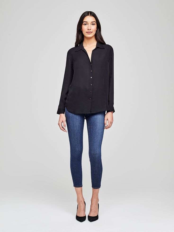 A modern classic. The Nina blouse is structured in all the right places with a relaxed, flattering fit. Refined button-down construction with a chic open collar and draped long sleeve in black silk. Elegant Black Blouse With Shirttail Hem, Sleek Collared Blouse For Workwear, Sleek Business Casual Blouse With Button Cuffs, Sleek Spring Blouse With Button Closure, Sleek Collared Blouse For Business Casual, Sleek Business Casual Blouse For Fall, Sleek Workwear Blouse With Button Closure, Sleek Blouse With Button Cuffs For Business Casual, Sleek Button-up Blouse For Business Casual