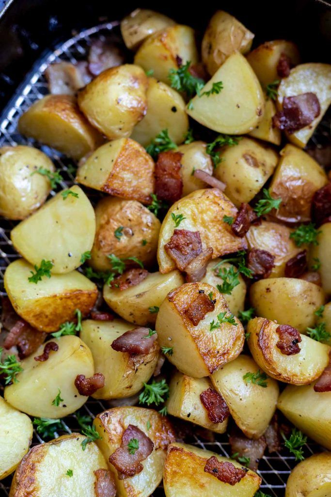 cooked potatoes with bacon and parsley in an air fryer