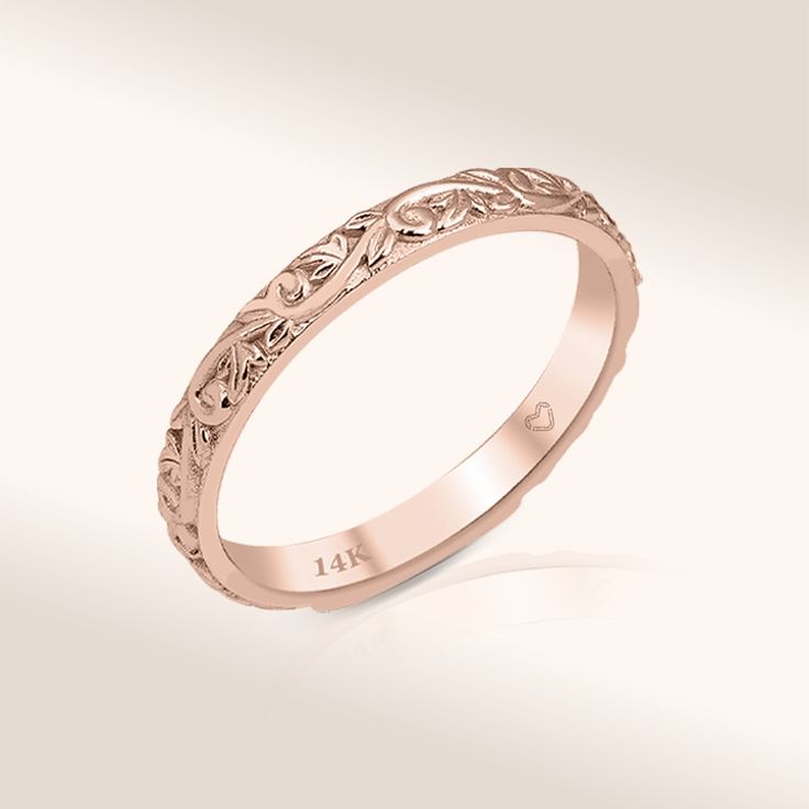 Celebrate birthdays, graduations, anniversaries, and more with our Leaf Wedding Band. Immerse yourself in the exquisite beauty of our 14K Solid Gold Ring, meticulously crafted with intricate floral patterns that reflect the delicate wonders of nature. Each carefully drawn design captures the essence of nature's beauty, making this ring a true work of art. Beyond its aesthetic appeal, this piece is not only a graceful choice for a wedding band but also a versatile stackable ring that effortlessly Yellow Gold Wedding Jewelry With Engraving Option, Heirloom Engraved Round Marriage Ring, Yellow Gold Engraved Stackable Wedding Rings, Engraved Yellow Gold Stackable Rings For Wedding, Round Engraved 14k Gold Wedding Ring, Engraved Yellow Gold Stackable Wedding Rings, Classic Design Engraved Wedding Ring, Gold Wedding Bands With Engraving Option, 14k Gold Stackable Rings With Decorative Band For Wedding