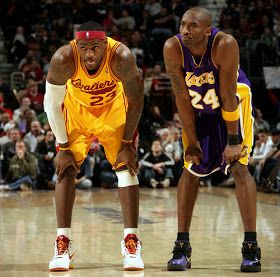 two basketball players are standing on the court