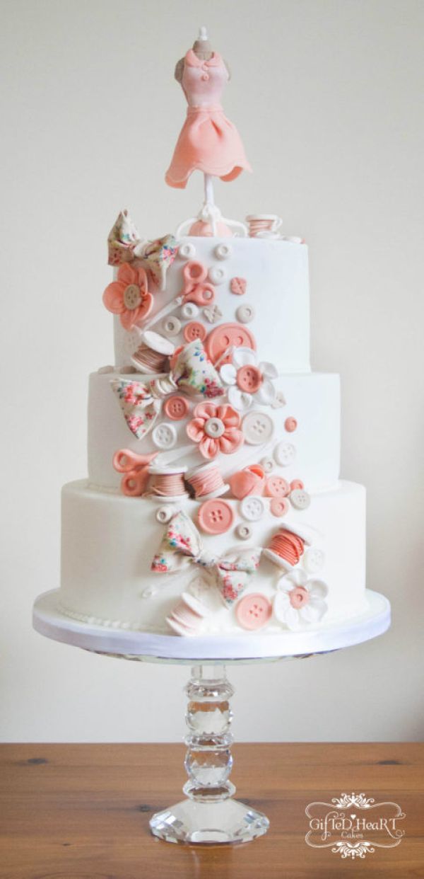 a wedding cake decorated with buttons and flowers