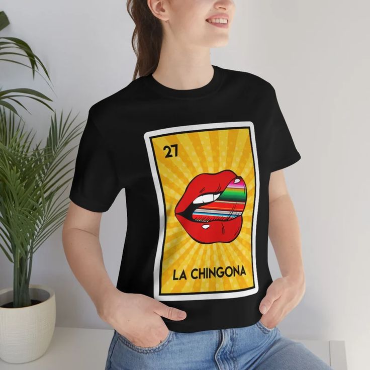 La Chingona the Badass Loteria Unisex T-shirt - Etsy Funny Crew Neck Top With Front Print, Funny Graphic Design Tops With Relaxed Fit, Funny Graphic Relaxed Fit Tops, Funny Graphic Print Top For Fans, Funny Graphic Print Tops For Fan Merchandise, Funny Print Graphic Tee For Fan Merchandise, Funny Print Graphic Tee For Fans, Graphic Tee With Funny Print For Fans, Funny Fan Merchandise Tops With Sublimation Print