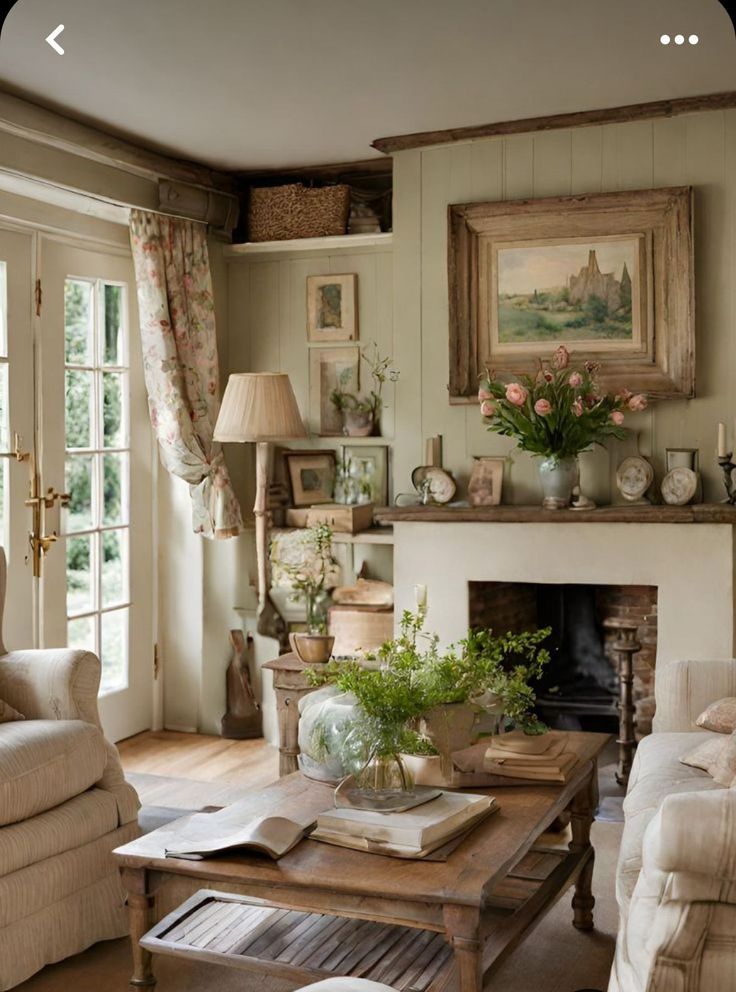 a living room filled with furniture and a fire place in front of a painting on the wall