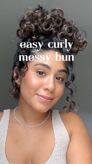 Curly Buns With Bangs, Curly Hair High Bun Tutorial, Long Curly Hair Bun Tutorial, Messy Bun Curly Hair Natural Curls, How To Do A Curly Bun, Messy Buns For Curly Hair, Curly Top Bun, Messy Bun Tutorial Curly Hair, Curly Hair Messy Bun Tutorial