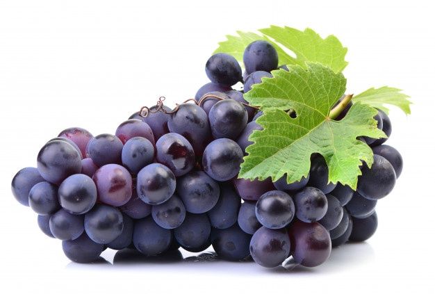 a bunch of grapes and a leaf on a white background