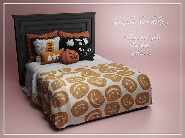 a bed with pumpkins and jack - o'- lantern pillows on it in front of a pink background