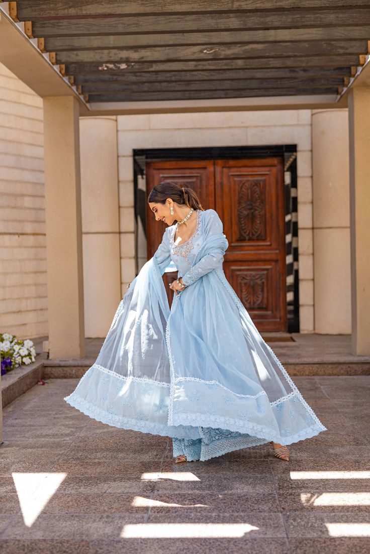 This ice blue shade Peshwas is refreshing to sight on our in house booti Laden silk. Hand embellished encrusted neckline With fully embroidered borders on hem and sleeves finished with laces. Organza dupatta with cotton organza in-house schiffli booti borders on pallu and silk pants compliment the look. Style it up with pearl statement jewellery this season for iftar dinners, Eid brunches or to an intimate Nikkah. Statement Jewellery, Organza Dupatta, Silk Pants, Pakistani Outfits, Iftar, Ice Blue, Statement Jewelry, Borders, Silk