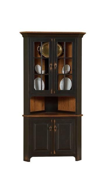 an old fashioned china cabinet with glass doors