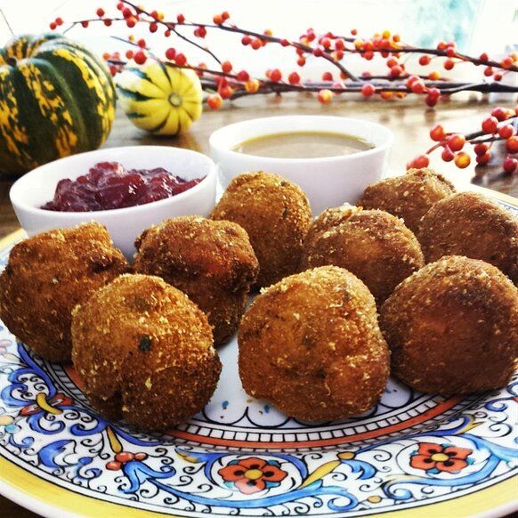 some fried food on a plate with dipping sauce