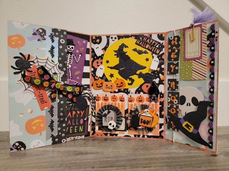 an open halloween card with lots of decorations