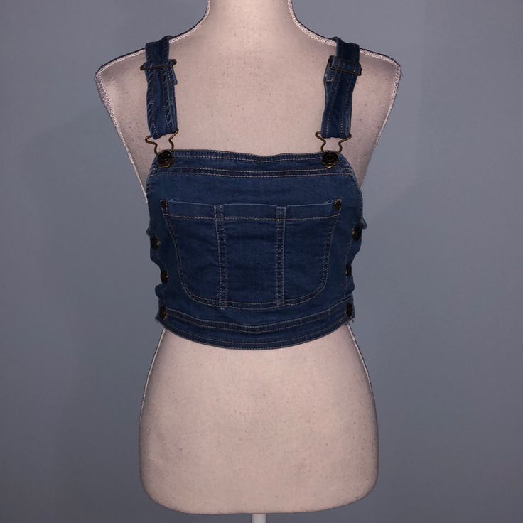 New With Tags Denim Crop Top By Mebon By Machine Jeans. Size Medium. Has Pocket On Front. Buttons On Side. Has Adjustable Straps. Stretches Some. About 14.5” Across And 16” From Top Of Shoulder To Bottom. Trendy Cropped Blue Denim Vest, Blue Denim Vest For Day Out, Cropped Blue Denim Vest With Pockets, Trendy Blue Denim Top, Maroon Crop Top, Cold Shoulder Crop Top, Bodice Top, Grey Crop Top, Denim Crop Top