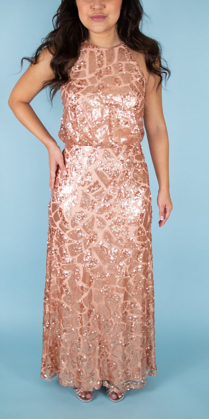 td {border: 1px solid #ccc;}br {mso-data-placement:same-cell;} Beautiful sequined gown featuring a halter neck. Perfect for a maid of honor or some sparkle in your bridal party. Brand: Donna Morgan Retail Price: $290 Color: Rose Gold Interior: Nylon; Exterior: Polyester Fully Lined Model Info: Height: 5'2 Waist: 26'' Wearing a size 2 *Style Notes: This dress runs small. Sequin Fabric For Wedding And Prom Season, Glamorous Bridesmaid Sequin Dress For Party Season, Sequin Halter Neck Party Gown, Halter Neck Sequin Party Gown, Fitted Halter Neck Sequin Wedding Dress, Fitted Halter Neck Sequin Dress For Wedding, Glamorous Sequin Fabric For Wedding And Prom Season, Glamorous Sequined Bridesmaid Gown, Sequin Bridesmaid Gown Floor-length