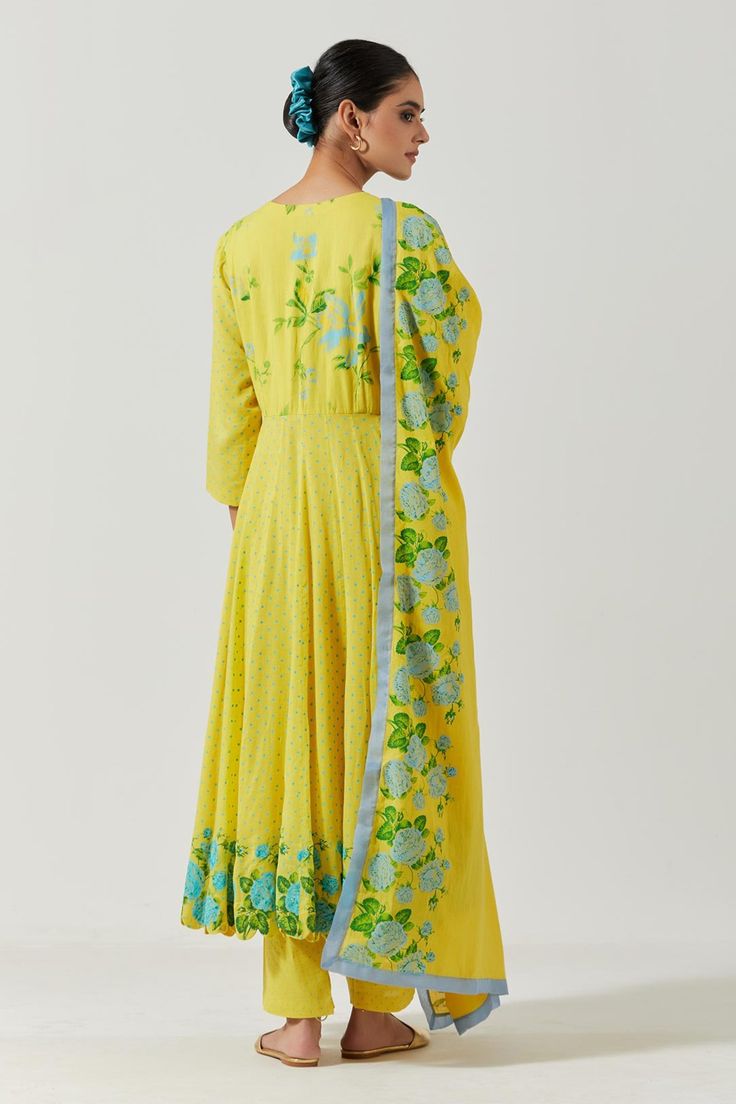 Yellow cotton mul V neck gathered kurta with floral print detailing on yoke and hemline. Comes with pant and printed dupatta.
Component: 3
Pattern: Printed
Type Of Work: Floral
Neckline: V neck
Sleeve Type: Three quarter
Fabric: Cotton Mul
Color: Yellow
Other Details: 
Gathered details
Floral print details
Occasion: Mehendi and Haldi - Aza Fashions Kurta Set For Women, Printed Dupatta, Kurta Set, Set For Women, Yellow Floral, Anarkali, Aza Fashion, Fabric Cotton, Sleeve Type