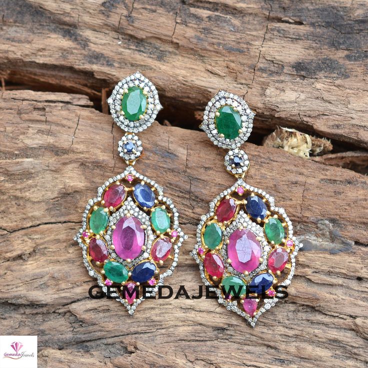 Ruby Gemstone Earrings, Emerald Silver Earrings, Pave Diamond Earrings, Sapphire Gemstone Jewelry, 925 Silver Gold Plated Jewelry, Gifts Gross Weight: 16.32 gram Gemstone Weight: 16.87 cts Diamond Weight: 1.90 cts Earrings Size: 54X26 MM NOTE:- All The Products Are Designed And Manufactured In My Workshop By Me & My Team. Shown Products Are Purely Handmade. Custom Orders Are Open Handly Accepted. We Are the Perfect Choice For Any Custom Jewelry Manufacturing. For Bulk Orders Please Message m Multicolor Diamond Round Earrings, Multicolor Round Diamond Earrings, Formal Multi-stone Cubic Zirconia Earrings, Multicolor Diamond Gemstone Earrings, Fine Jewelry Multicolor Cubic Zirconia Earrings, Multicolor Cubic Zirconia Fine Jewelry Earrings, Multicolor Cubic Zirconia Earrings Fine Jewelry, Diamond Multi-stone Earrings For Anniversary, Multicolor Diamond Jewelry Set With Matching Earrings