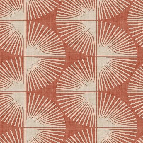 an orange and white pattern on fabric