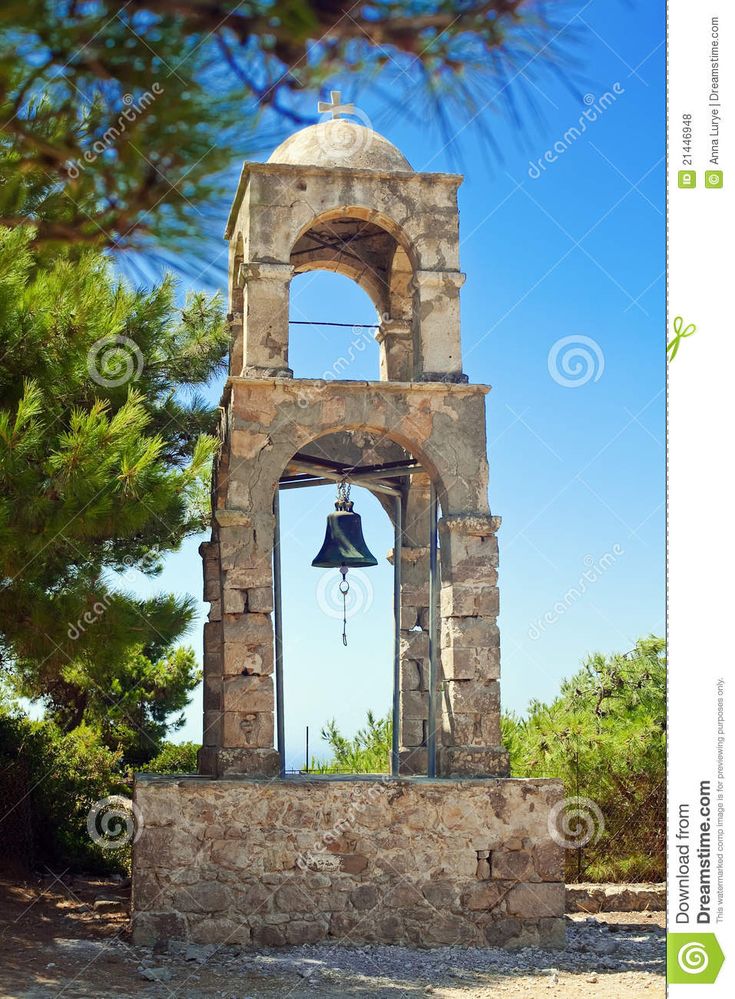 an old bell tower with a bell on top