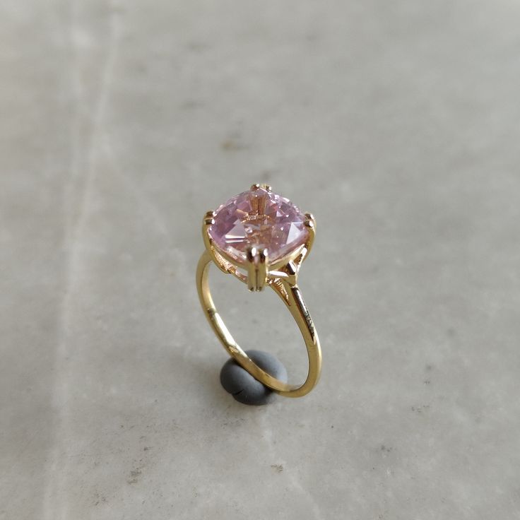 ITEM DESCRIPTION: >>The Ring is made from Solid 14K Yellow Gold. Gemstone used is absolutely natural and ethically sourced.  >>Natural Kunzite in cushion octagon shape is studded on it with utmost precision.  Gem: Kunzite Gem size: 9x19 mm  Gem weight: 4.36 carat Gold purity: 14K (58.33% approx.) Gold weight: 1.46 grams Gross weight :  2.33 grams The Gold purity is guaranteed and it comes with authentic 14K gold hallmark. Since these Rings are handmade, they are Nickel/Lead FREE.  CUSTOMISATION: Heart Cut Ring With Center Stone In 14k Gold, Kunzite Ring With Accent Stones For Wedding, Anniversary Rings With Prong Setting In Kunzite, Tourmaline Gemstone Ring For Wedding, Tourmaline Ring With Center Stone For Wedding, Morganite Gemstone Wedding Ring, Sapphire Ring For Wedding With Round Cut, Wedding Tourmaline Gemstone Rings, Heirloom Heart Cut Gemstone Ring