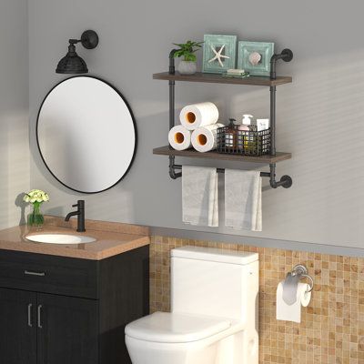 a bathroom with a toilet, sink and shelves